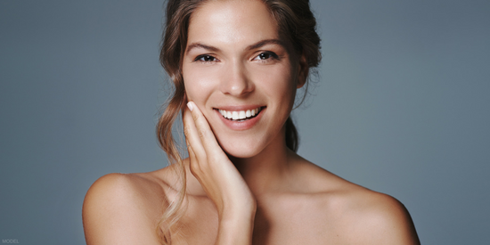 Smiling young woman with radiant skin